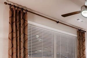 Spacious Bedroom with Plush Carpeting & Ceiling Fan
